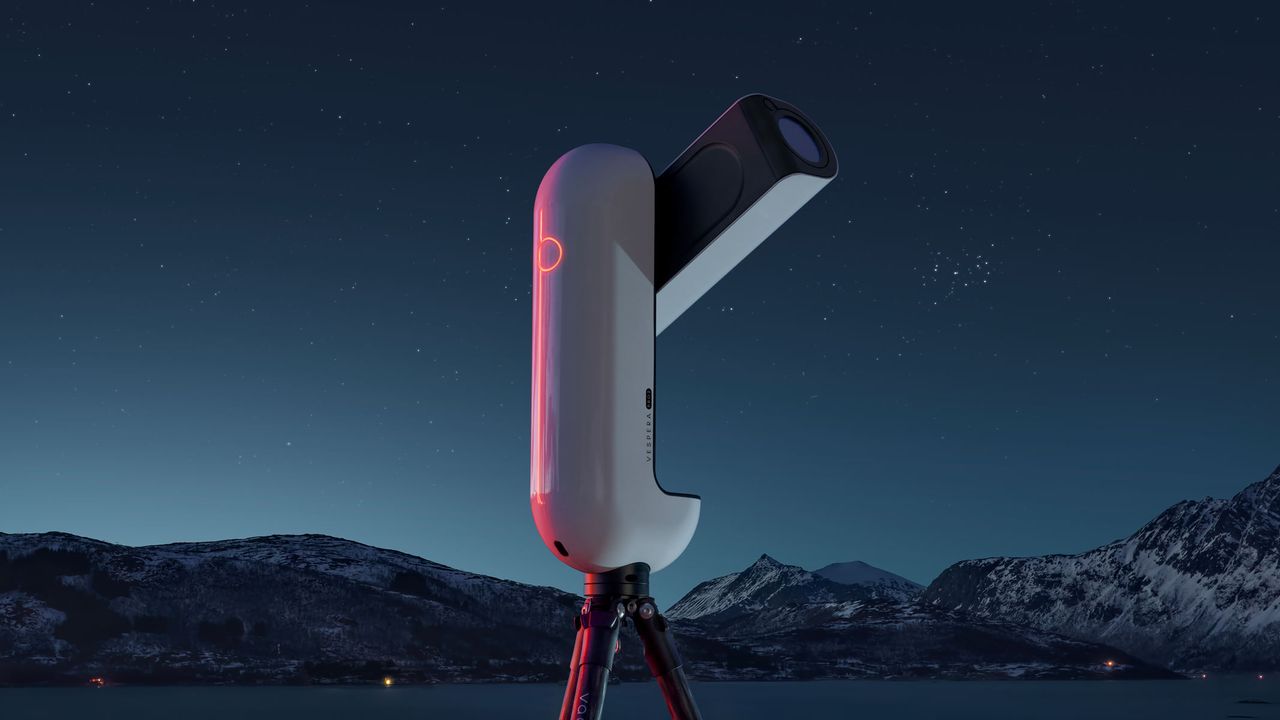 The Vaonis Vespera Pro 2 with a starry mountain backdrop.