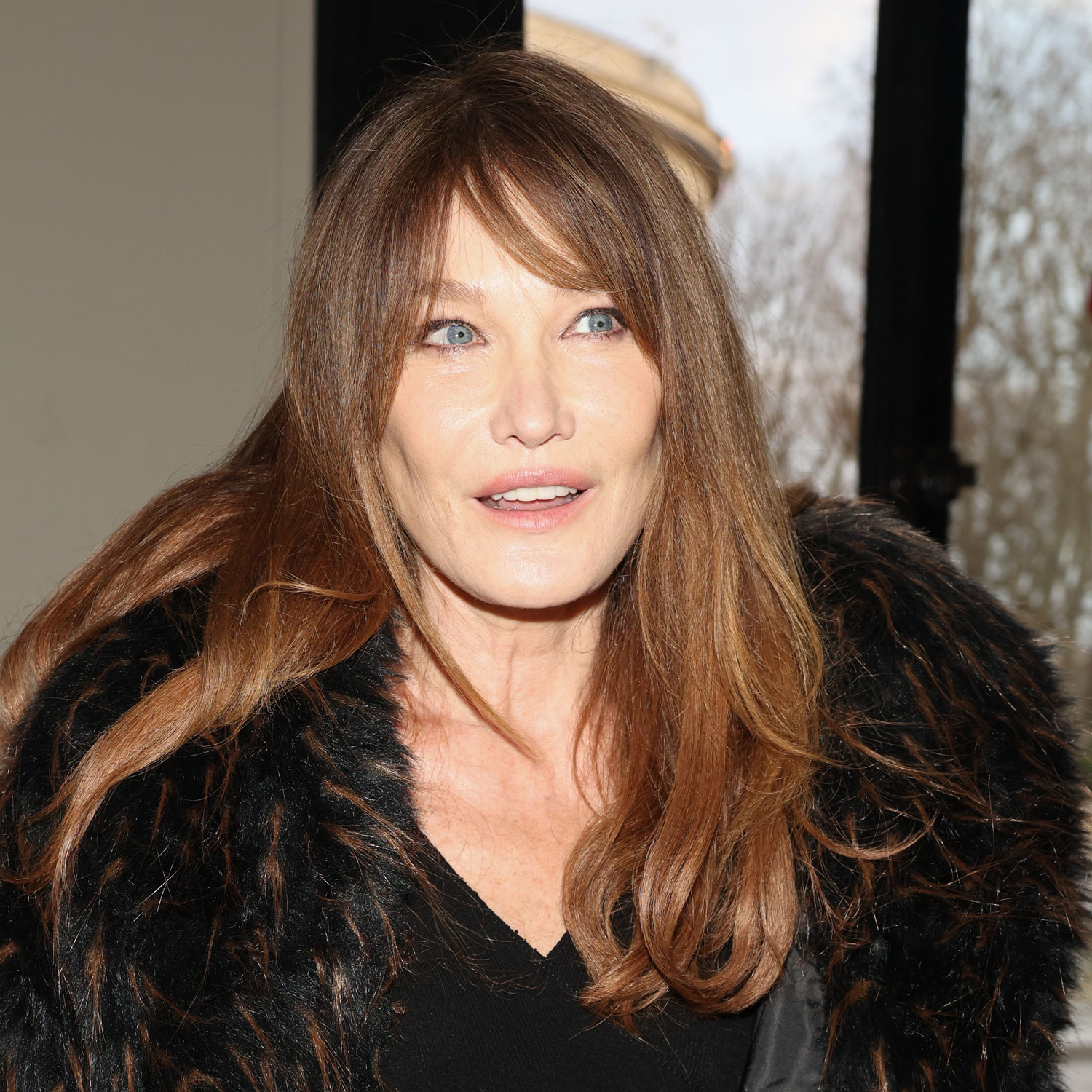 Carla Bruni Just Traveled in a Quintessentially French Airport Outfit