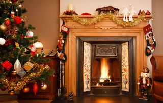 Decorated fireplace in a family home with Christmas tree