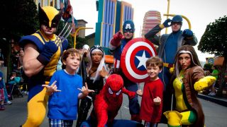 Kids posing with Marvel characters at Universal's Islands of Adventure