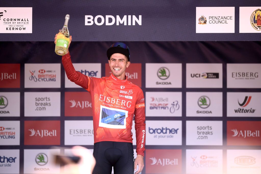 BODMIN ENGLAND SEPTEMBER 05 Jacob Scott of United Kingdom and Team Canyon DHB Sungod celebrates winning the red sprint jersey on the podium ceremony after the 17th Tour of Britain 2021 Stage 1 a 1808km stage from Penzance to Bodmin TourofBritain TourofBritain on September 05 2021 in Bodmin England Photo by Harry TrumpGetty Images