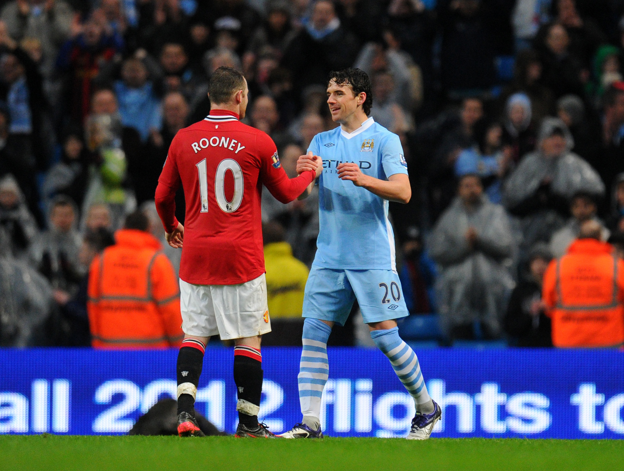 Manchester City's Owen Hargreaves greets former Manchester United team-mate Wayne Rooney in a derby in the FA Cup in January 2012.