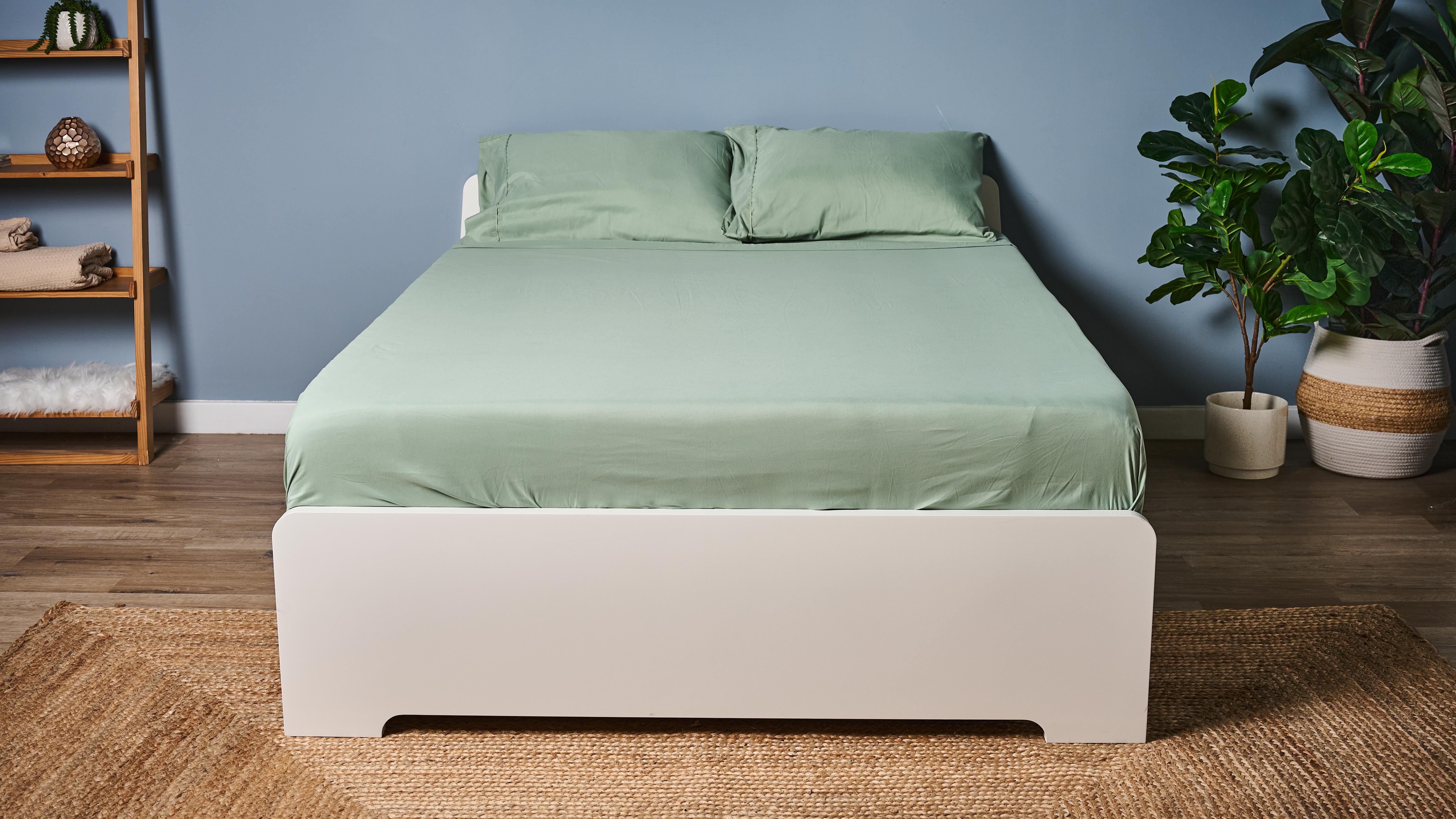 Our TG sleep studio bed dressed up in a sage green Utopia Bedding Sheet set 