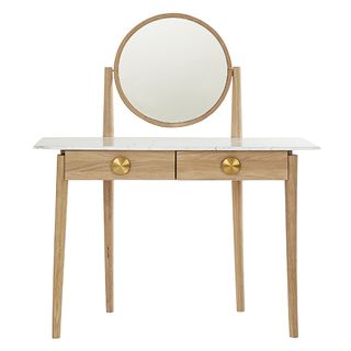 dressing table with capacious drawers for storage featuring tactile brass handles