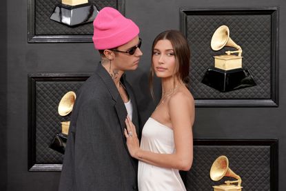 LAS VEGAS, NEVADA - APRIL 03: (L-R) Justin Bieber and Hailey Bieber attend the 64th Annual GRAMMY Awards at MGM Grand Garden Arena on April 03, 2022 in Las Vegas, Nevada. (Photo by Jeff Kravitz/FilmMagic)