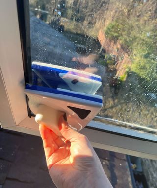 The magnetic window cleaning tool on the window