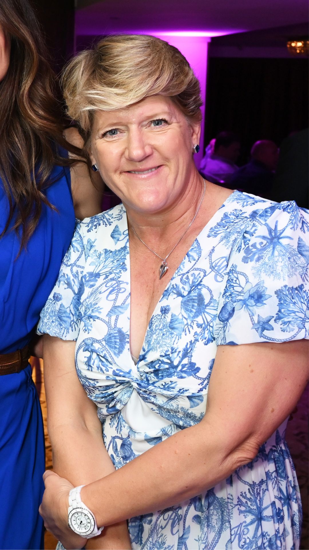 CLARE BALDING WEARING A BLUE AND WHITE DRESS
