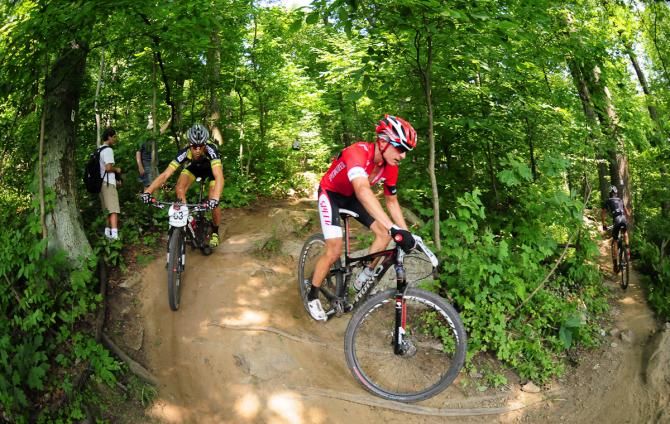 Howard Gotts (Specialized) riding a 180-degree turn behind Russell Finsterwald and trailed by Kerry Werner