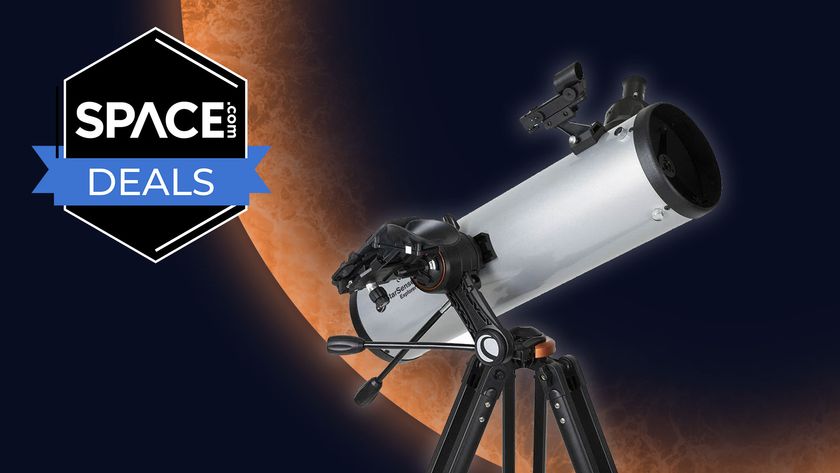 A Celestron StarSense Explorer DX 130AZ telescope on an orange planet background with a black Space.com deals badge in the upper left corner. 