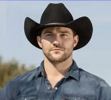 Image of man in a denim shirt wearing a black stetson hat