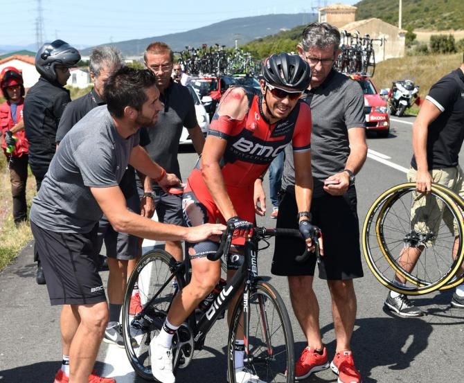 Steve Morabito gets a helping hand from his BMC team after his crash