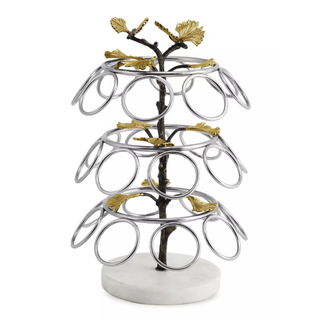 A cutout product image of an ornate stainless steel and marble cup stand