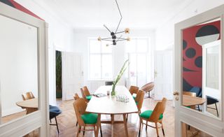 Wooden dining table and chairs with green pads