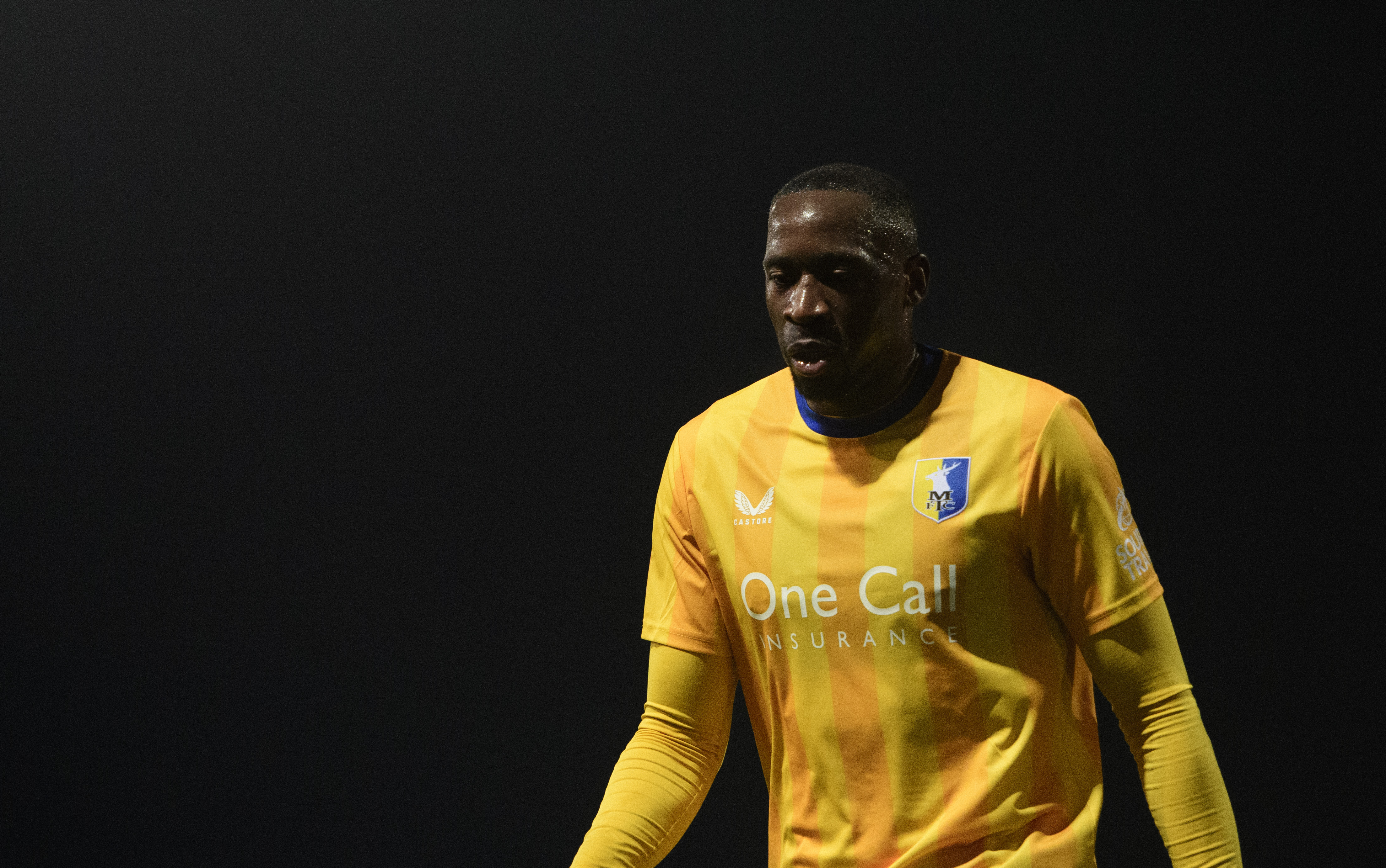MANSFIELD, ENGLAND - FEBRUARY 18: Lucas Akins of Mansfield Town looks on during the Sky Bet League One match between Mansfield Town FC and Lincoln City FC at One Call Stadium on February 18, 2025 in Mansfield, England. (Photo by Chris Vaughan/Getty Images)