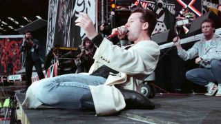 Simple Minds’ Jim Kerr on his knees onstage in 1988