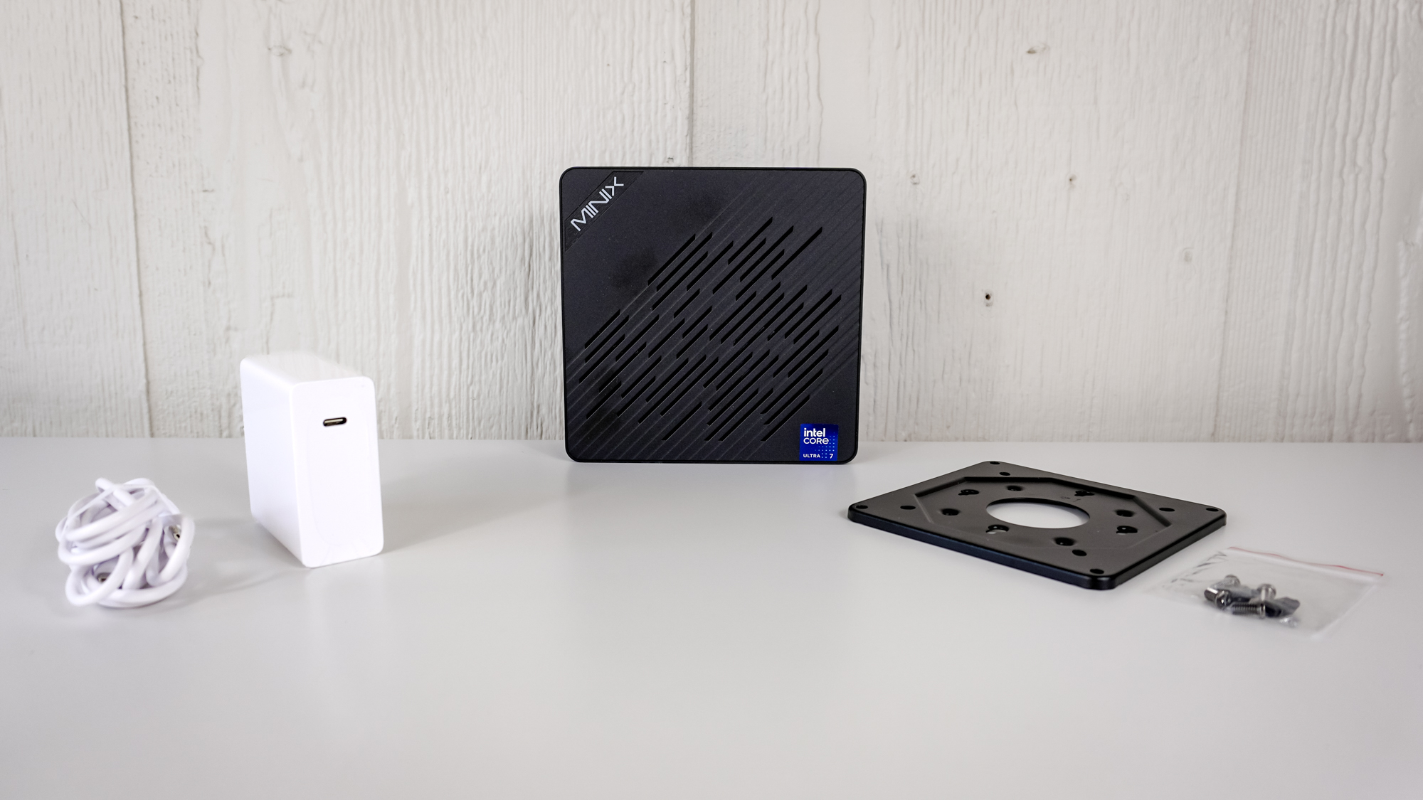 The Minix Elite EU715-AI unboxed on a table