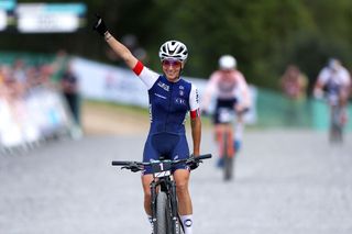 Pauline Ferrand Prevot of France celebrates at finish line as race winner during the Women Elite Cross-country Short Track at the 96th UCI Cycling World Championships Glasgow 2023 (Photo by Dean Mouhtaropoulos/Getty Images)