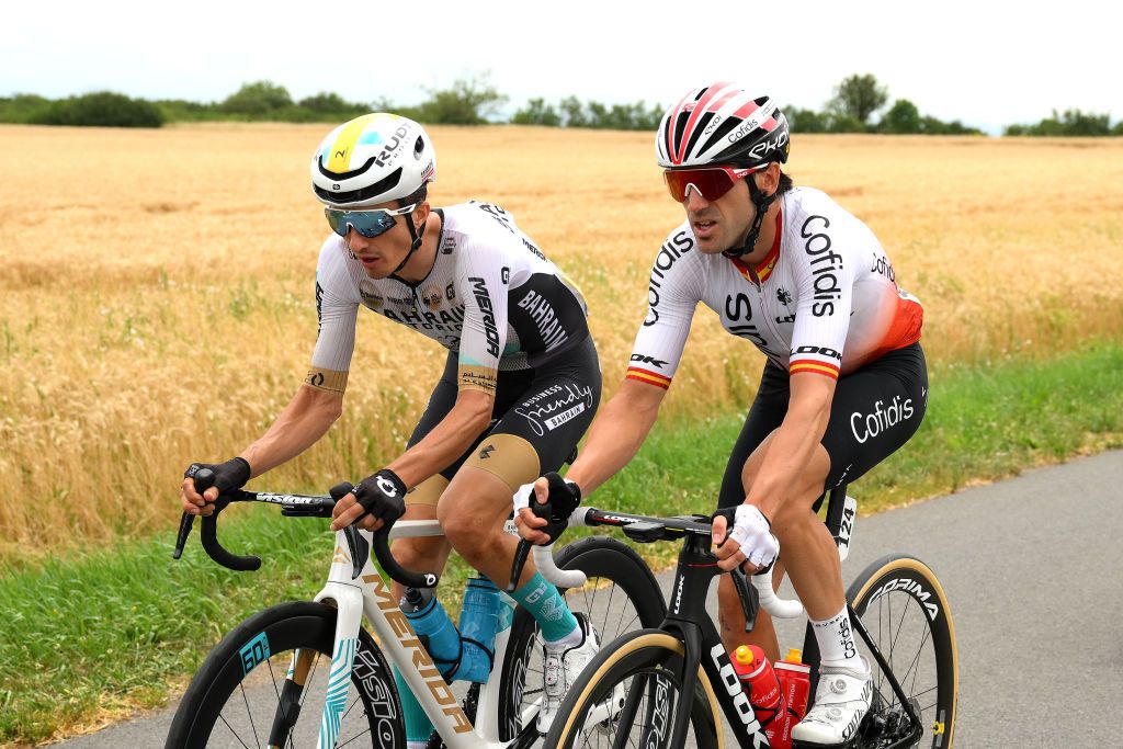 MOULINS FRANCE JULY 12 LR Pello Bilbao of Spain and Team Bahrain Victorious and Ion Izagirre of Spain and Team Cofidis compete during the stage eleven of the 110th Tour de France 2023 a 1798km from ClermontFerrand to Moulins UCIWT on July 12 2023 in Moulins France Photo by David RamosGetty Images