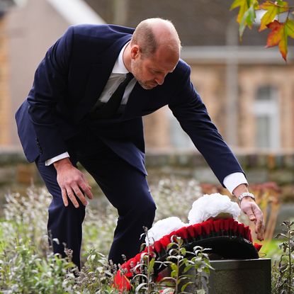 Prince William laying a wreath in Aberfan