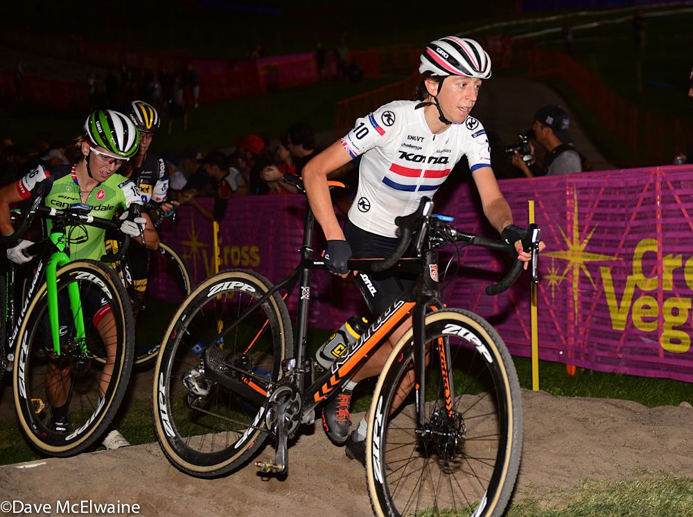 Helen Wyman (Kona) running a set of stairs on lap three with Kaitie Antonneau (Cannondale) behind her