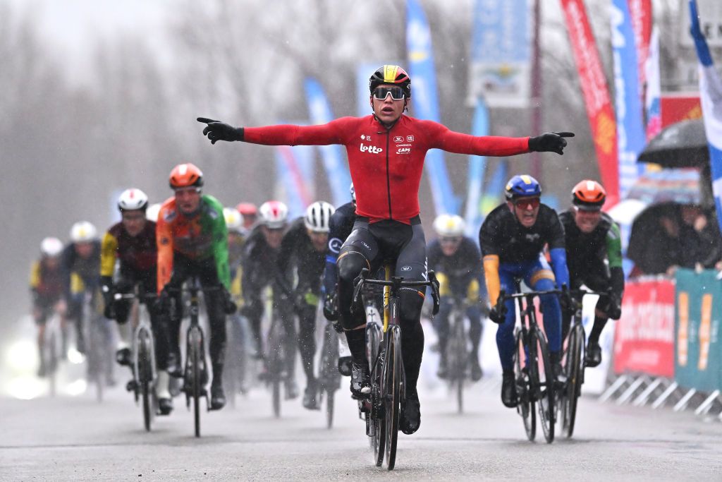 Arnaud De Lie of Team Lotto celebrates in the rain at finish line as stage 3 winner at 2025 Etoile de Besseges-Tour du Gard