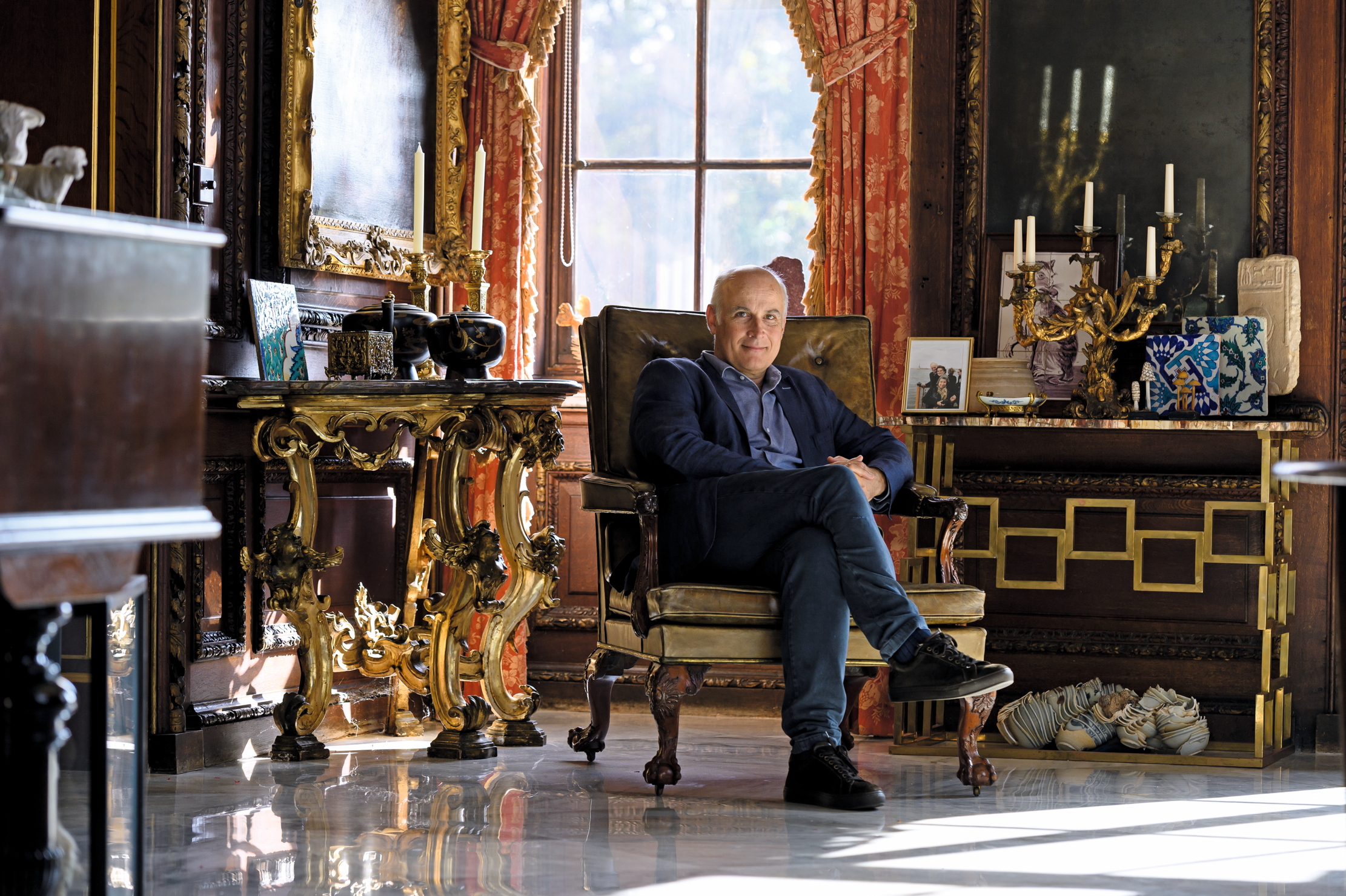 Orlando Rock photographed sitting in his living room at Burghley