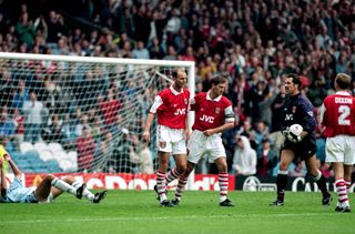 Manchester City v Arsenal - Arsenal goalkeeper David Seaman holds the ball after making a save as Steve Bould and Tony Adams leave the box.