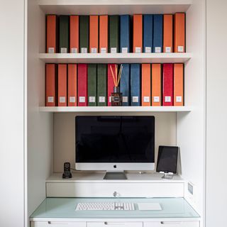 room with desk and computer