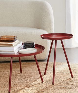 H&M Home US Furniture and lamps launch campaign image with boucle sofa, red side and coffee tables, stoneware tray and glass box