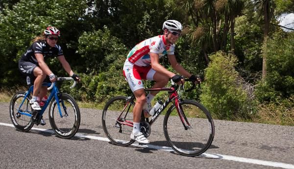 Scott Thomas (Unique Realty) and Shane Archbold (Bike NZ) roll to the finish behind the peloton.