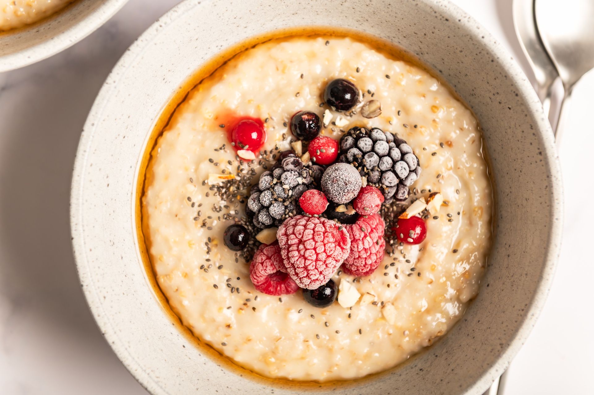 A bowl of porridge topped with fruit