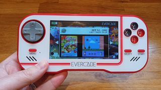 A photo of the Evercade console being held