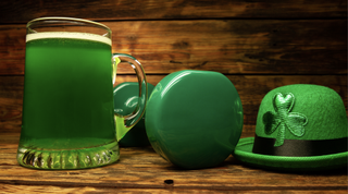 an image of green Guinness, hat and a dumbell