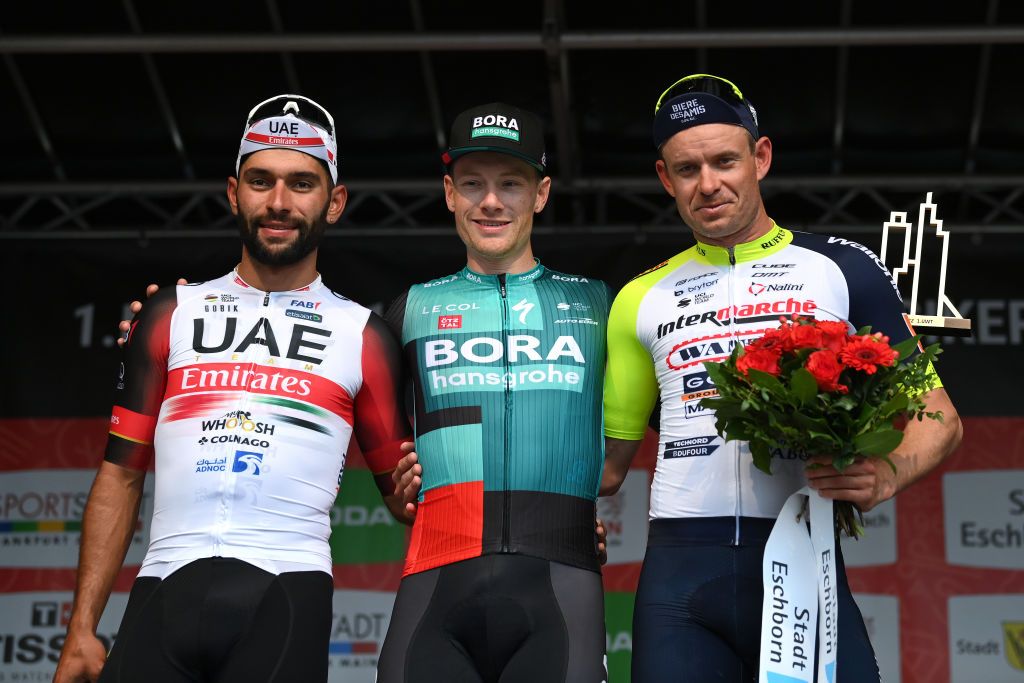 FRANKFURT AM MAIN GERMANY MAY 01 LR Fernando Gaviria Rendon of Colombia and UAE Team Emirates on second place race winner Sam Bennett of Ireland and Team Bora Hansgrohe and Alexander Kristoff of Norway and Team Intermarch Wanty Gobert Matriaux on third place pose on the podium ceremony after the 59th EschbornFrankfurt 2022 a 185km one day race from Eschborn to FrankfurtamMain WorldTour on May 01 2022 in Frankfurt am Main Germany Photo by Stuart FranklinGetty Images