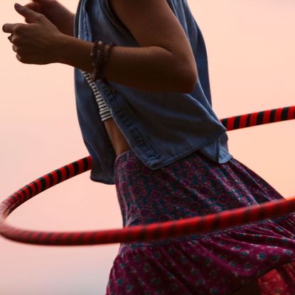 A woman trying hula hoop workouts