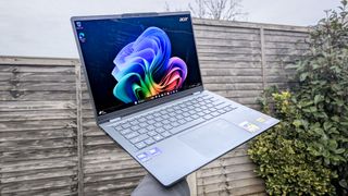 Acer Swift 14 AI being raised with hand