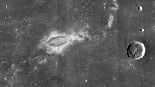 a dark grey image of the lunar surface with scattered craters of various size.