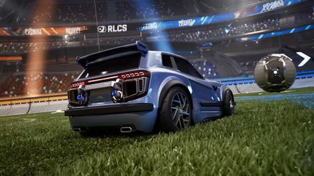 A car in Rocket League on Unreal Engine 6. I The vehicle is very shiny and is in front of the ball on a soccer field. 