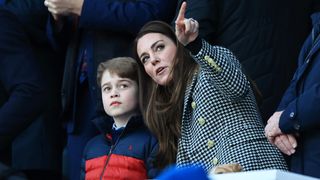 Catherine, Duchess of Cambridge speaks to son Prince George of Cambridge prior to the Guinness Six Nations Rugby match