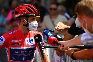 LES PRAERESNAVA SPAIN AUGUST 28 Remco Evenepoel of Belgium and Team QuickStep Alpha Vinyl Red Leader Jersey meets the media press at start prior to the 77th Tour of Spain 2022 Stage 9 a 1714km stage from Villaviciosa to Les Praeres Nava 743m LaVuelta22 WorldTour on August 28 2022 in Les Praeres Nava Spain Photo by Tim de WaeleGetty Images