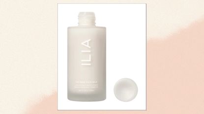 A close up of ILIA's The Base Face Milk moisturiser in a cream and beige gradient template