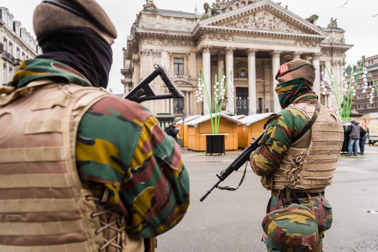 Belgian soldiers patrol near the old Brussels&amp;#039; stock exchange.