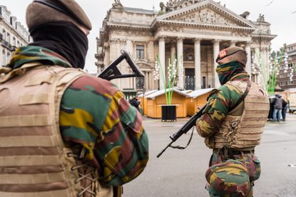 Belgian soldiers patrol near the old Brussels' stock exchange.