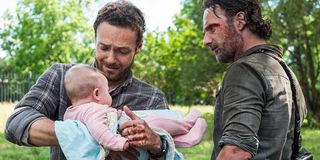 The Walking Dead Aaron holds baby Gracie with Rick Grimes AMC