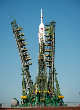 Service Arms Raised Around Expedition 36 Soyuz Rocket