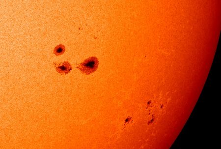 A group of sunspots. More sunspots appear near solar maximum than at solar minimum.