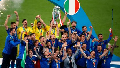 Italy captain Giorgio Chiellini lifts the Henri Delaunay trophy at Wembley 