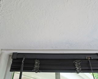 textured ceiling above bay window