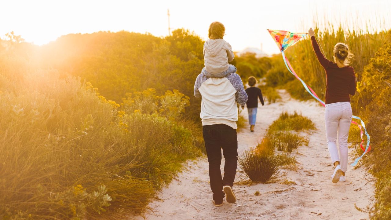 Family walking in the sunshine