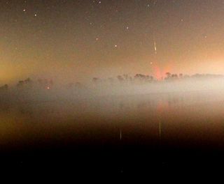 This close-up of a photo by amateur astronomer Mark Staples of Waldo, Fla., shows an Orionid meteor on Oct. 22, 2011 as it blazed over Little Lake Santa Fe.